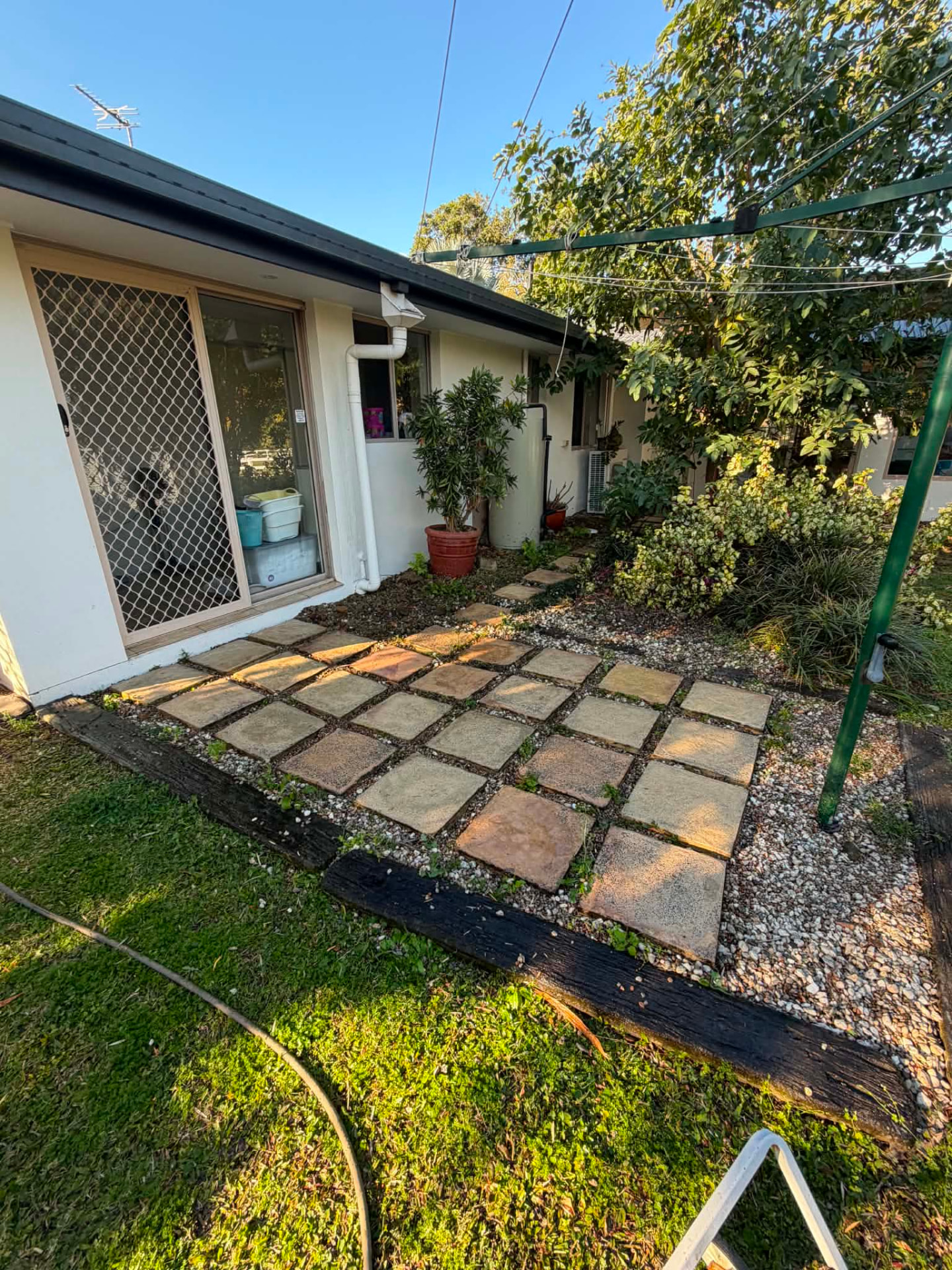 Same paver courtyard cleared of weeds and cleaned up